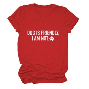 Close-up of 'DOG IS FRIENDLY' white text print on red cotton crew neck T-shirt