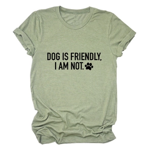Close-up of sage green cotton t-shirt with humorous black text and dog paw print