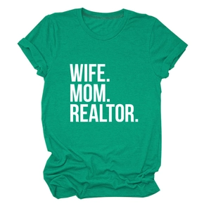 Close-up of vibrant green cotton t-shirt with white WIFE MOM REALTOR printed lettering