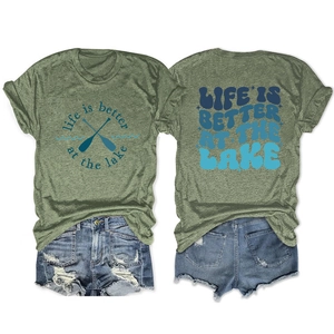 Detail view of olive green t-shirt with Lake slogan and distressed denim shorts