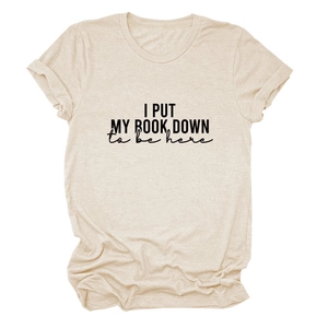 Detail of oat-beige t-shirt with I PUT MY BOOK DOWN print and rolled sleeve design