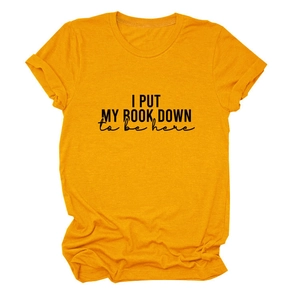 Close-up of ginger yellow crew neck t-shirt with black artistic book lover print