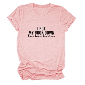 Detail of pink marl short sleeve t-shirt with I Put My Book Down printed text