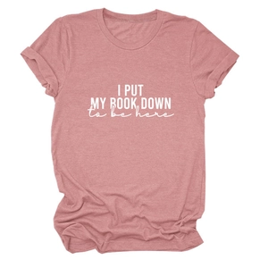Close-up of the white printed text on a dusty pink casual round neck cotton t-shirt