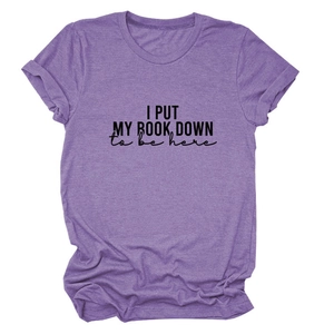 Detail of soft heather purple t-shirt featuring I Put My Book Down printed slogan