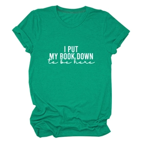 Close-up of emerald green cotton T-shirt featuring white I Put My Book Down printed slogan