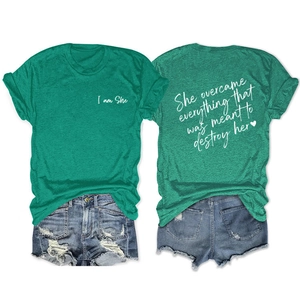 Green T-shirt with inspirational white text and distressed denim shorts casual set