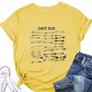 Flat lay of mustard yellow t-shirt with vintage DATE DUE card print on a white surface
