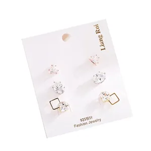 Three-pair gold cubic zirconia stud earring set featuring triangle and square shapes
