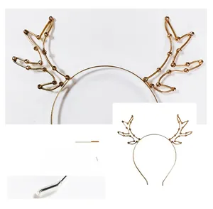 Detailed view of golden antler headband with sparkling rhinestones and protective tips