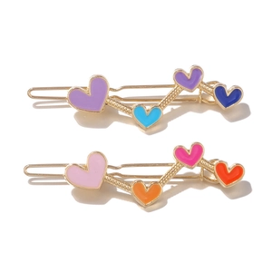 Set of two colorful heart-shaped hair clips in golden alloy with vibrant drip oil finish