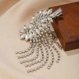 Elegant silver flower hair clip featuring rhinestone tassels and sparkling crystals