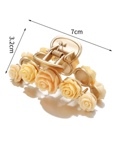 Detail view of 7cm champagne rose hair claw clip with dimensions on white background