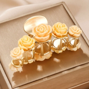 Elegant champagne gold metal hair claw clip with cream resin roses for women