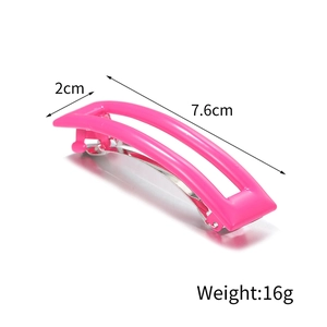 Detail view of pink rectangular acetate hair clip with 7.6cm length and 2cm width