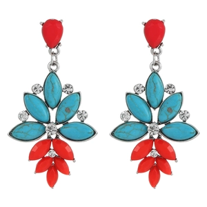 Detailed view of bohemian style drop earrings with red resin stones and turquoise accents