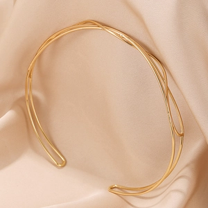Elegant minimalist double-layer golden U-shaped choker necklace on satin background