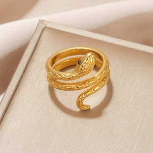 Macro shot of gold-plated snake ring with detailed scale texture and black zircon eyes