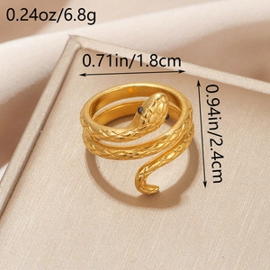 Macro detail of gold-plated snake ring showing scale texture and measurement specs