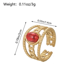 Detail view of gold snake ring with red oval stone and dimension labels 2cm x 1.4cm