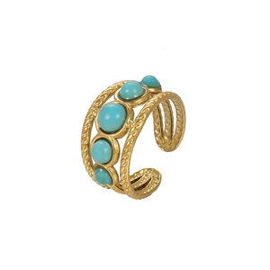 Detail of bohemian gold snake ring featuring five inlaid turquoise cabochon stones