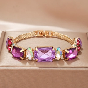 Bracelet vintage en alliage doré avec cristaux violets taille émeraude et gemmes colorées