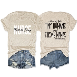 Flat lay of cream T-shirt with Caring for Tiny Humans print and denim shorts with frayed hems