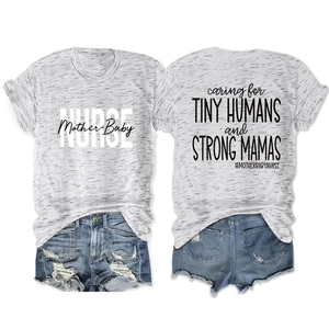 Detail of grey graphic T-shirt with caring for tiny humans text and denim shorts