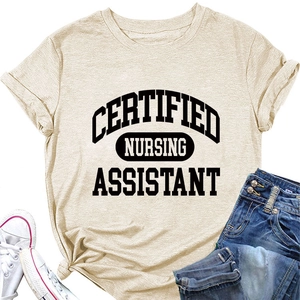 Detailed flat lay of beige Certified Nursing Assistant t-shirt with jeans and shoes
