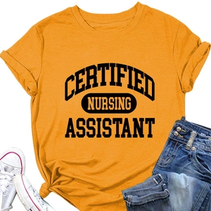 Flat lay of yellow Certified Nursing Assistant t-shirt with denim and white sneakers