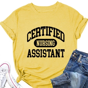 Flat lay of yellow Certified Nursing Assistant cotton T-shirt with denim and sneakers