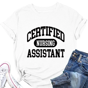 Flat lay of a white Certified Nursing Assistant T-shirt paired with jeans and sneakers