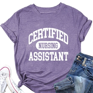 Flat lay of purple Certified Nursing Assistant t-shirt with denim shorts and shoes