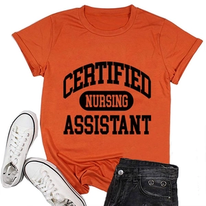 Close-up of bright orange nursing assistant t-shirt with bold black lettering