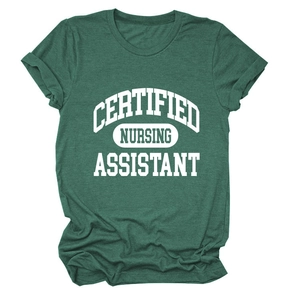 Close-up of the screen-printed Certified Nursing Assistant text on a green cotton T-shirt