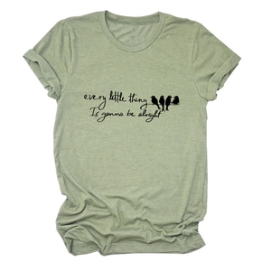 Detailed flat lay of sage green t-shirt with bird print and artistic text