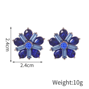 Elegant blue crystal star earrings with metal alloy base and rhinestone petals