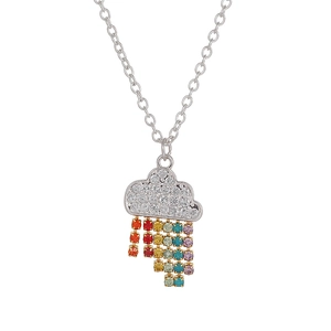 Macro view of cloud pendant with colorful rhinestone tassels on silver necklace