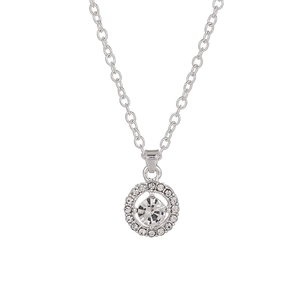 Macro shot of silver circular pendant featuring a faceted crystal and pavé rhinestones
