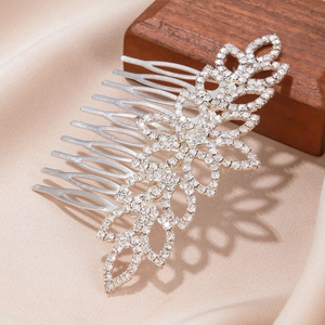 Silver bridal hair comb with shimmering rhinestones and leaf-shaped alloy design