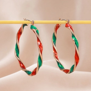 Christmas style twisted hoop earrings with red and green enamel spiral in gold plating