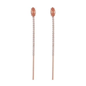 Close-up of long flower tassel earrings with rose gold plating and sparkling zircons