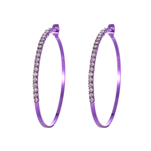 Close-up of large purple metal hoop earrings with sparkling rhinestones and star detail