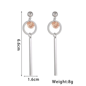 Detail view of flower drop earrings with rhinestones, measuring 6.6cm by 1.6cm