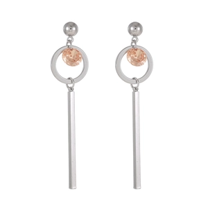 Detail of silver drop earrings with champagne zircon and long metal bar pendant