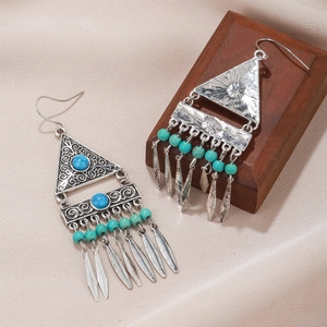 Bohemian ethnic drop earrings with turquoise beads and vintage tassel leaf charms