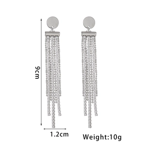 Detail of silver long tassel earrings with rhinestones showing 9cm height and 1.2cm width