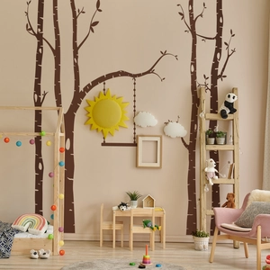 Nursery wall sticker featuring dark brown trees, yellow sun, and white clouds decor