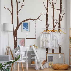 Detail of Nordic style dark brown tree wall decal with a creative swing for home decor