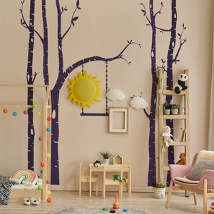 Detail of Nordic tree and swing wall decals in a cozy children's bedroom setting